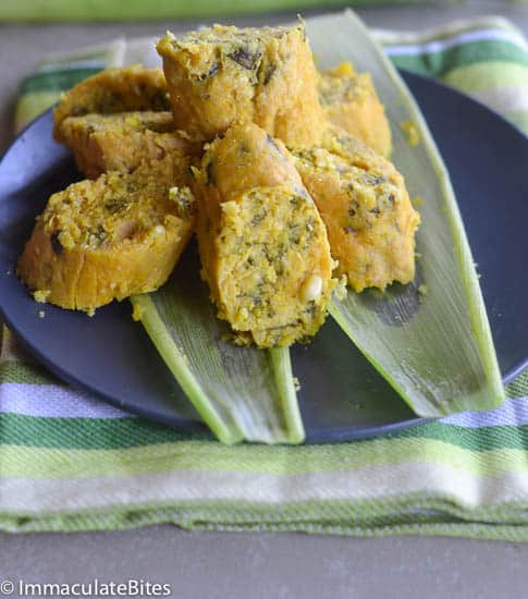 Koki Corn (African Fresh Corn Tamales) on a Blue Plate