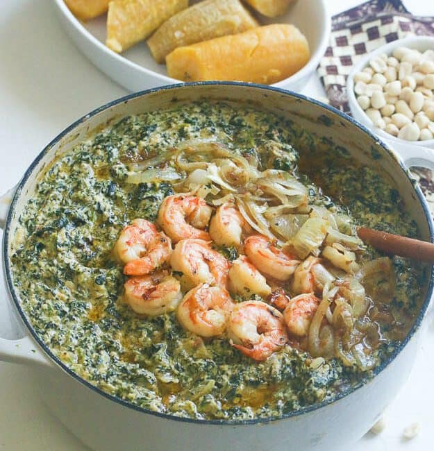 Enjoying nutritious and delicious ndole (spinach and shrimp) for Black History Month