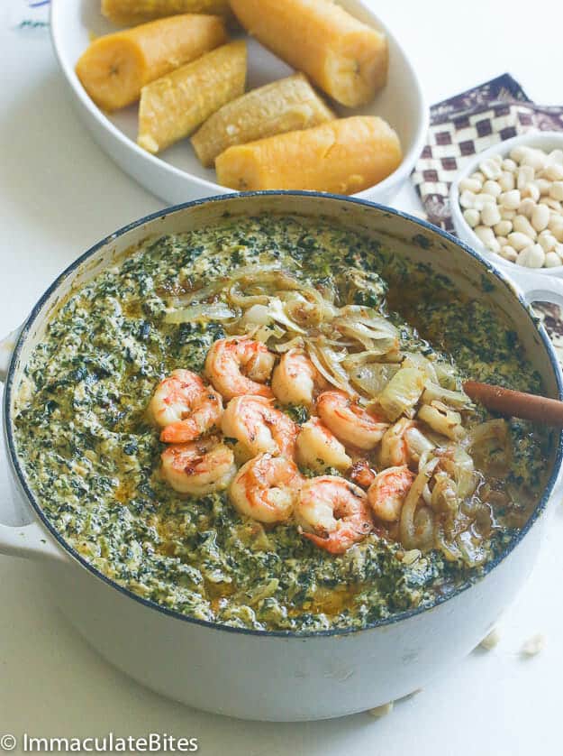 Enjoying nutritious and delicious ndole (spinach and shrimp) for Black History Month