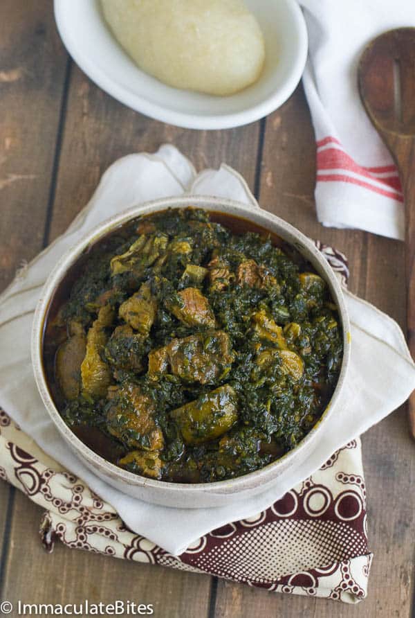 a bowl of Eru Soup(Spinach/Okazi leaves) served with fufu