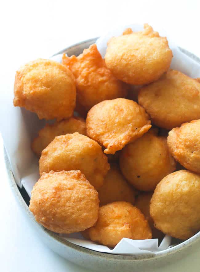 A bowl full of black-eyed peas fritters