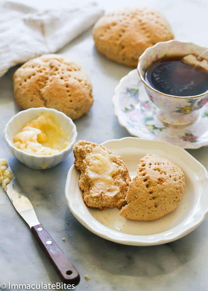 Enjoying insanely delicious bread with butter and a cup of coffee