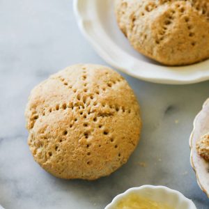 Coconut bakes with butter on a white plate