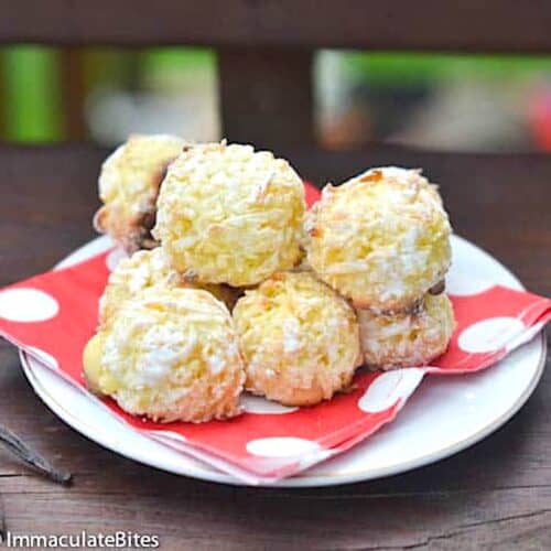 A napkin lined plate piled high with the sweet goodness of shuku shuku coconut balls.