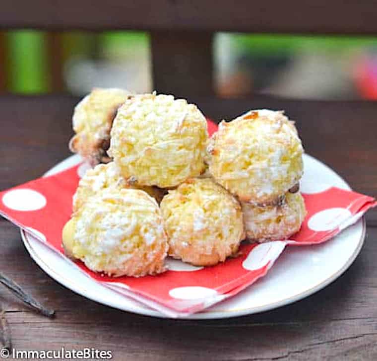 A napkin lined plate piled high with the sweet goodness of shuku shuku coconut balls.