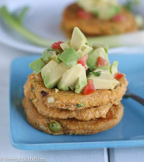 Enjoying tasty tatale topped with a healthy avocado salad