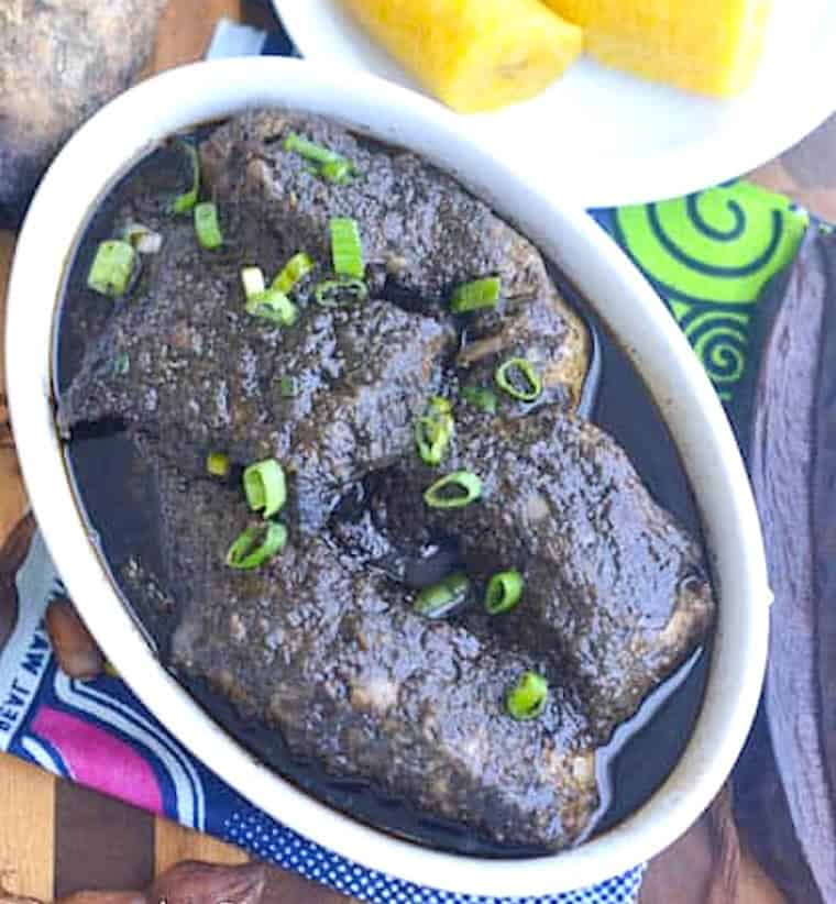 Mbongo tchobi or bongo is a spicy African black sauce over fish.