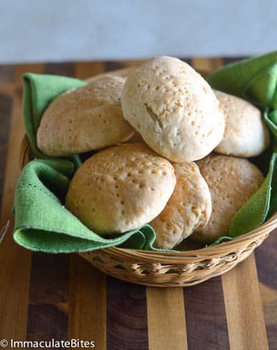 Fresh Johnny cakes in a basket lined with a green napkin. The perfect way to use coconut milk