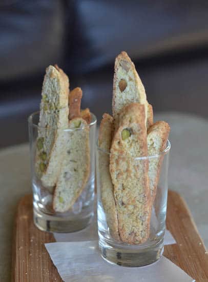 Banana Biscotti arranged in a clear glass ready to dip into coffee