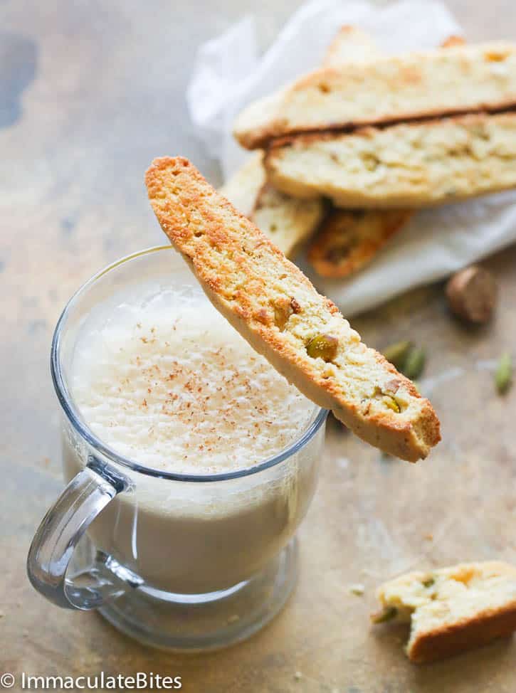 Enjoying homemade biscotti with a steaming cup of chai tea latte