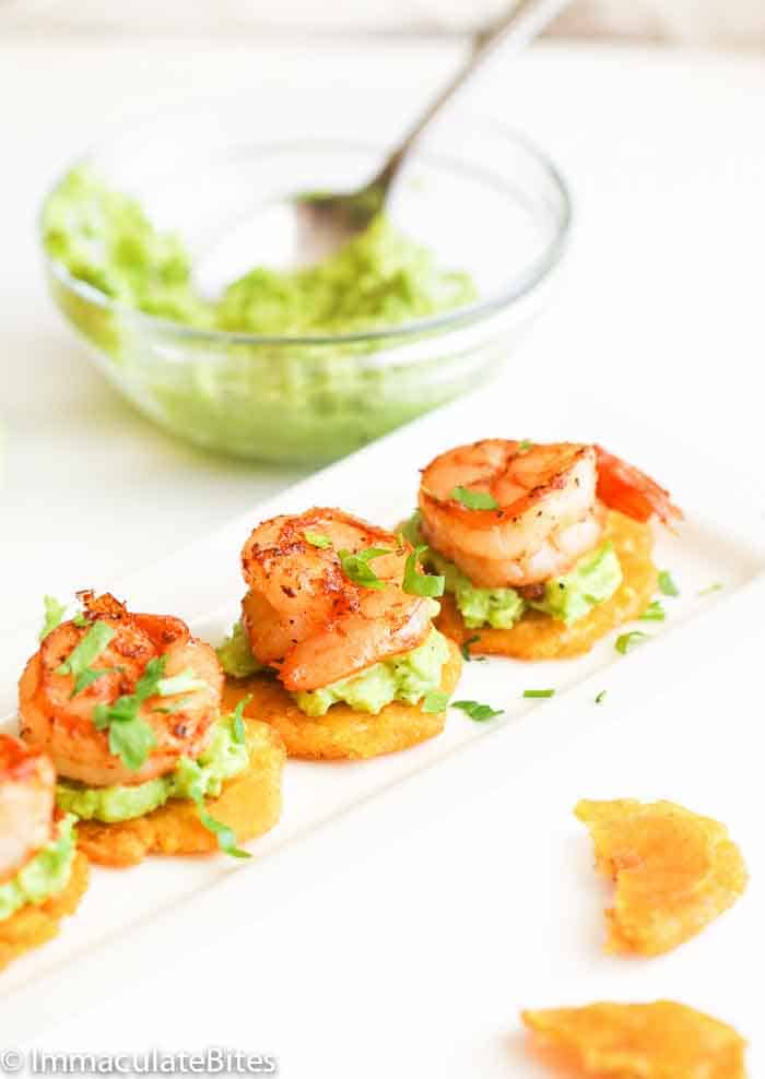 Tostones topped with guac and shrimp