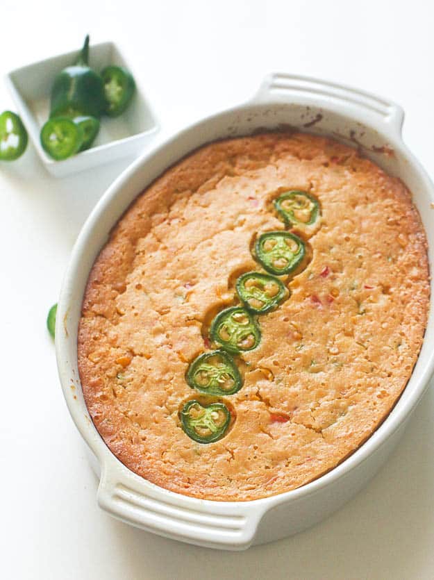Sweet and spicy jalapeno corn casserole topped with jalapeno slices