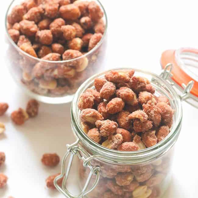 Two jars full of candied peanuts
