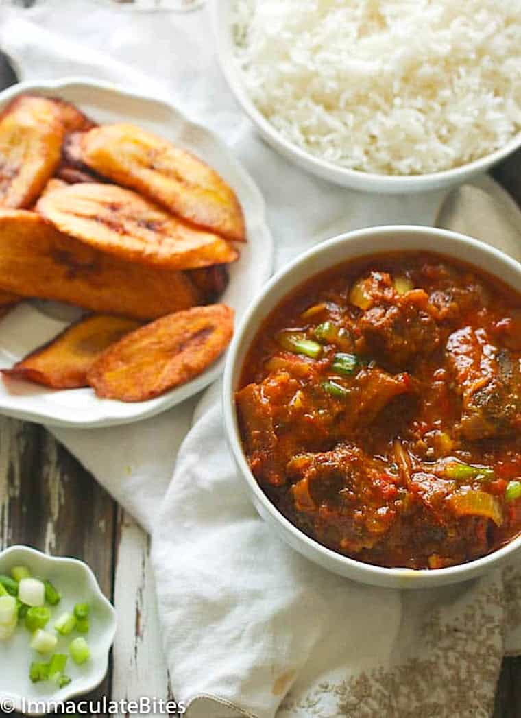 Stewed goat with curry spices and the right touch of heat with rice and fried sweet plantains.