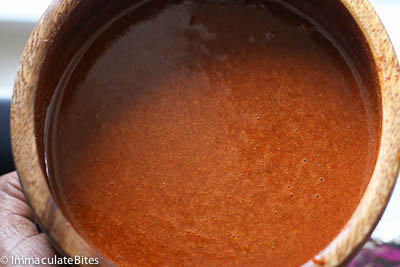 The sauce ready to use on the chicken suya