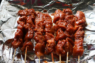 Chicken suya skewers going in the oven