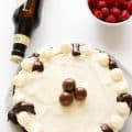 Guiness Chocolate Cake with raspberries and a bottle of beer