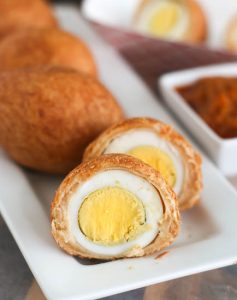 Slicing into an African Egg Roll or Nigerian scotch egg