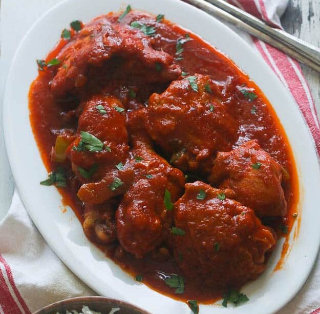Mouthwatering African Chicken Stew ready to serve with coconut rice