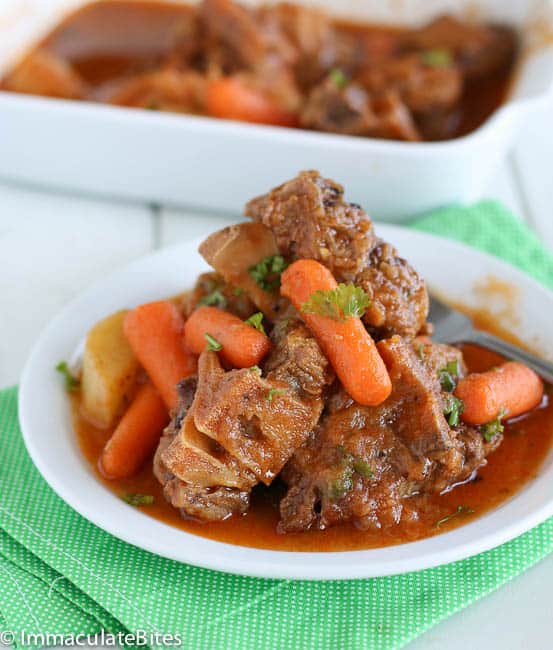 Enjoying a hearty bowl of Caribbean oxtail stew