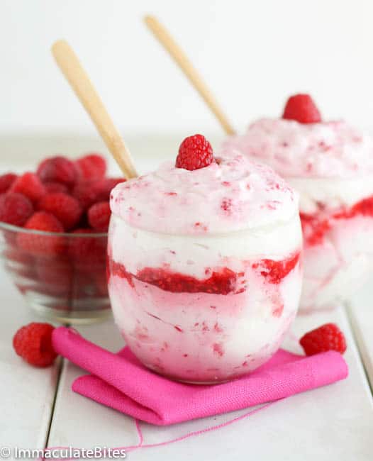 Two dessert glasses showing off gorgeous raspberry fools