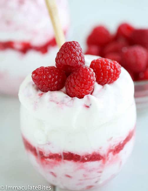 Raspberry fool topped with fresh raspberries for a refreshing summer dessert