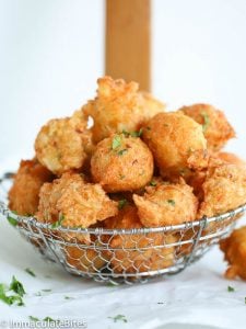 A basket of freshly fried saltfish fritter ready to enjoy