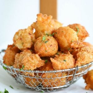 A basket of freshly fried saltfish fritter ready to enjoy