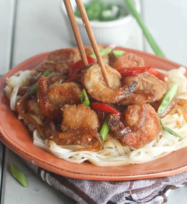 Diving into crazy delicious Mongolian shrimp with chopsticks
