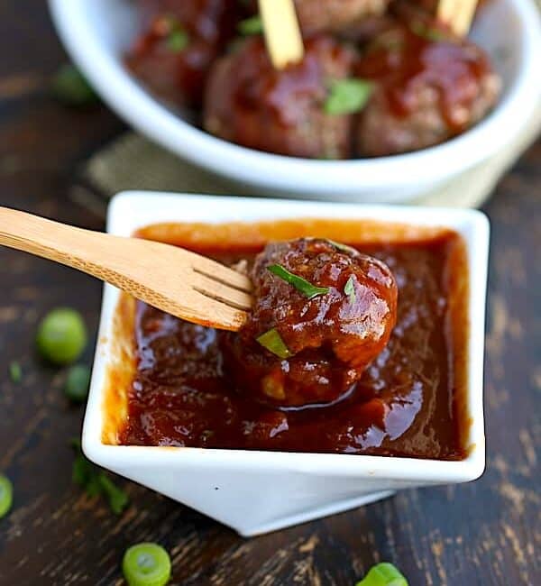 Dipping a freshly baked meatball into insanely tasty pineapple BBQ sauce