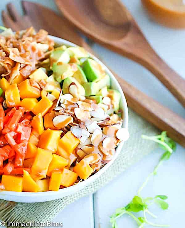 Drizzling mouthwatering Asian salad dressing over a pea sprout salad