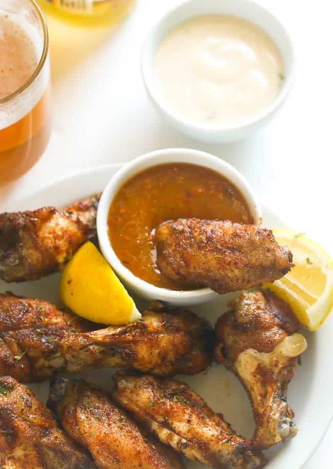 Baked Jerk Chicken Wings served with beer and remoulade sauce