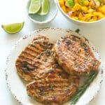 Rosemary Pork Chops with mango salsa and a squeeze of lime for a deliciously easy weeknight dinner