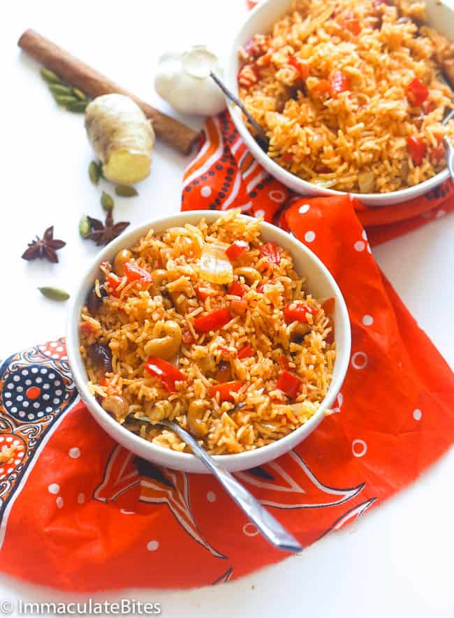 two servings of East African Pilau Rice with spices in the background