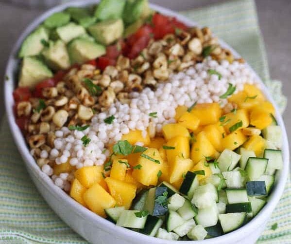 A gorgeous Mediterranean salad with couscous, mango, and corn