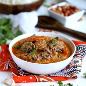 An amazing bowl of maafe (West African peanut soup) ready to enjoy over steaming hot rice