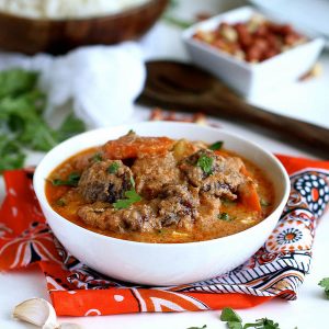 An amazing bowl of maafe (West African peanut soup) ready to enjoy over steaming hot rice