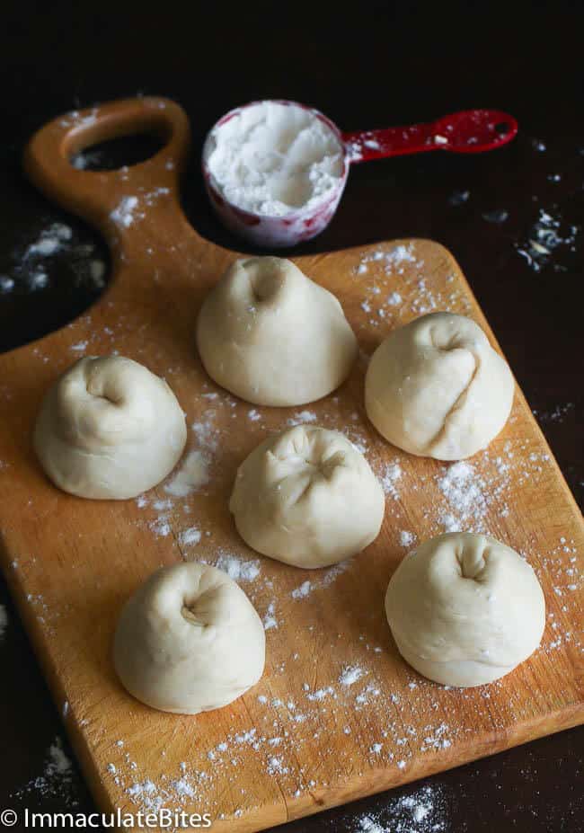Sliced and rolled dough balls ready to be flattened into buss up shut