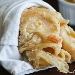 A buss up shut paratha roti wrapped in a towel and ready to enjoy