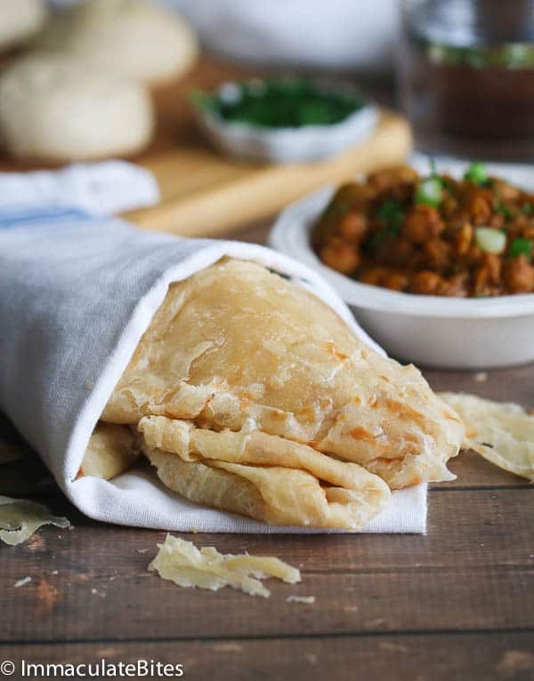 The paratha bus is wrapped in a towel and closed, ready to be enjoyed with chicken curry