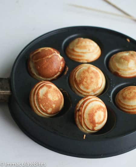 Aebleskiver Danish Pancakes hot in the aebleskiver pan and ready to enjoy