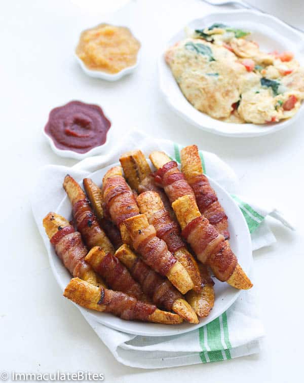 Bacon wrapped plantain strips straight from the oven with your choice of hot sauces