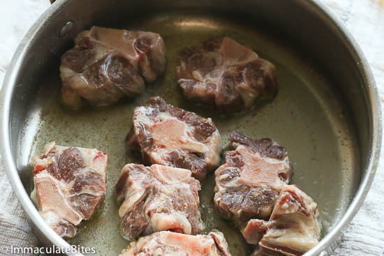 Searing the oxtails