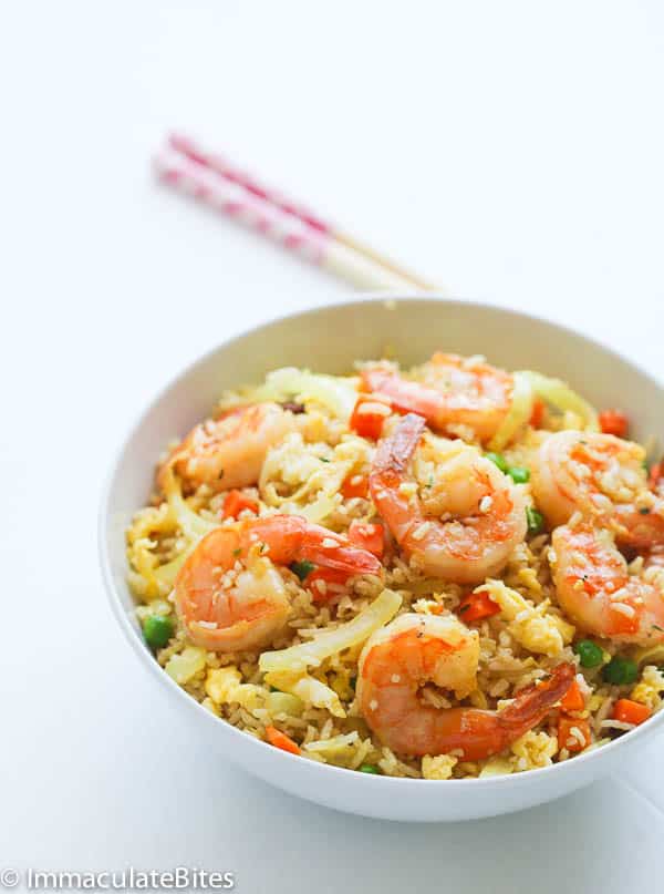 Enjoying Caribbean fried rice with shrimp on top