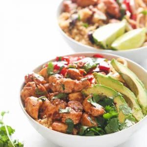 Serving up two delicious bowls of quinoa and beans with avocado slices