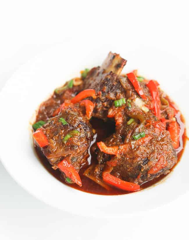 Jamaican Brown Beef  Short Ribs Stew on a White Plate