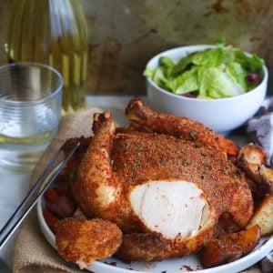 Whole Cajun Roast Chicken with a slice removed