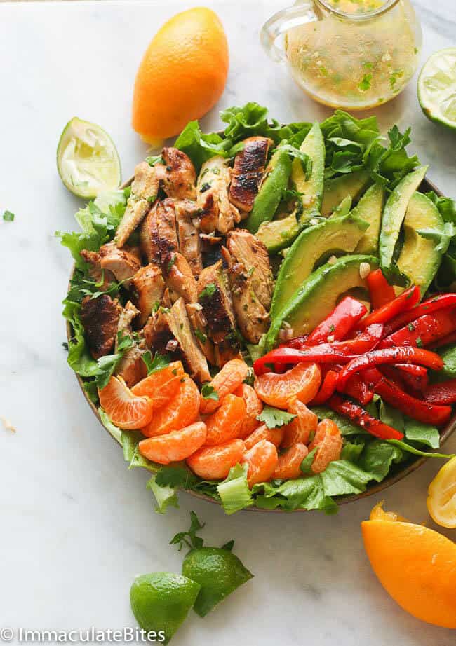 A Bowl of Chicken Citrus Avocado Salad with the Dressing on the Side
