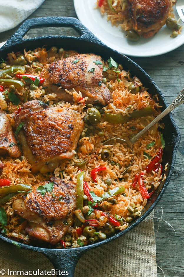 One Pot Puerto Rican Chicken and Rice with a Serving of it in the Background