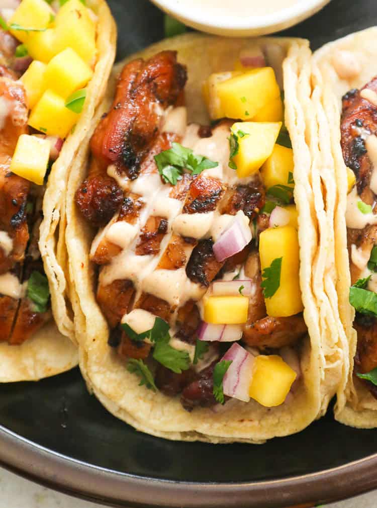 Grill Jerk Chicken Tacos Drizzled with Jerk Mayo Sauce and Mango Chunks